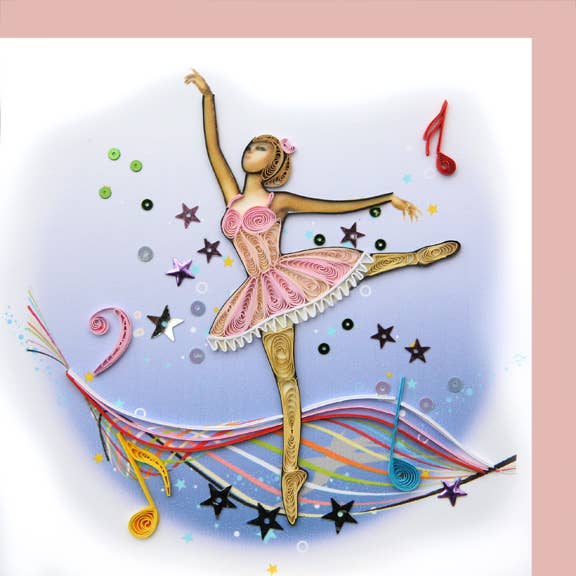 Quilled artwork of a ballerina with colorful ribbons and musical notes on a light pink background