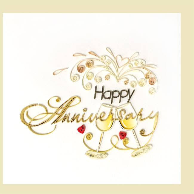 Decorative card with 'Happy Anniversary' text and wine glasses on a white background